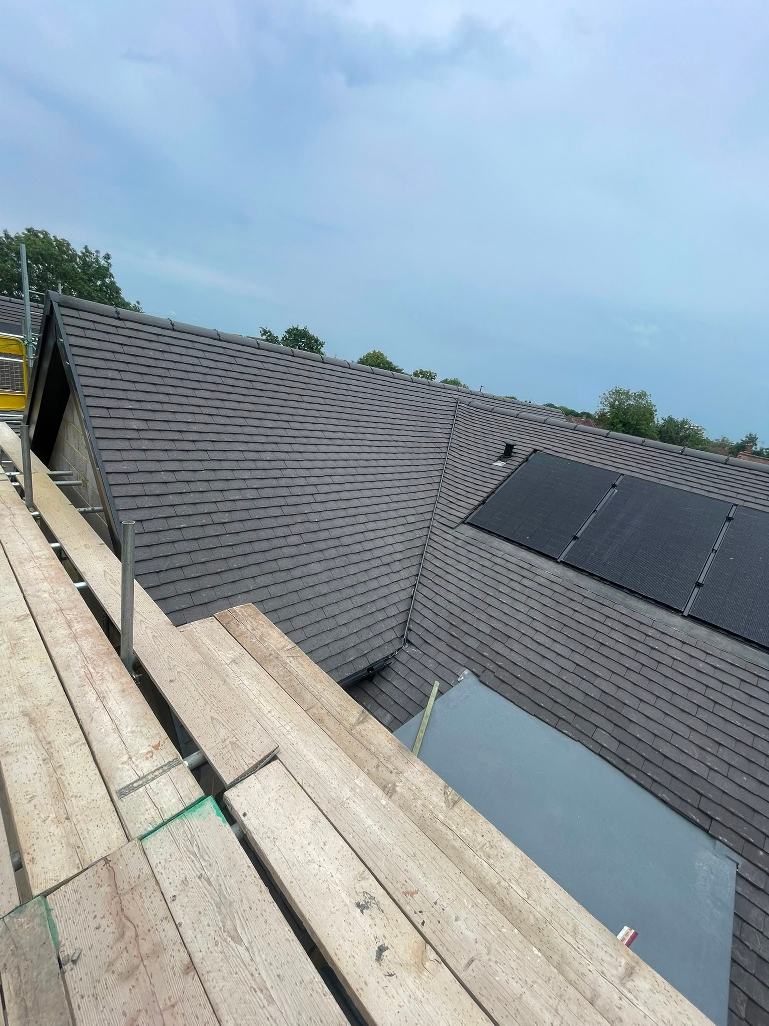Completed Tiled Roof with Solar Panels by B KARAN BUILD ROOFING Ltd